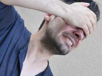 photo-of-man-with-headache