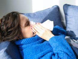 photo-of-woman-in-bed-suffering-flu